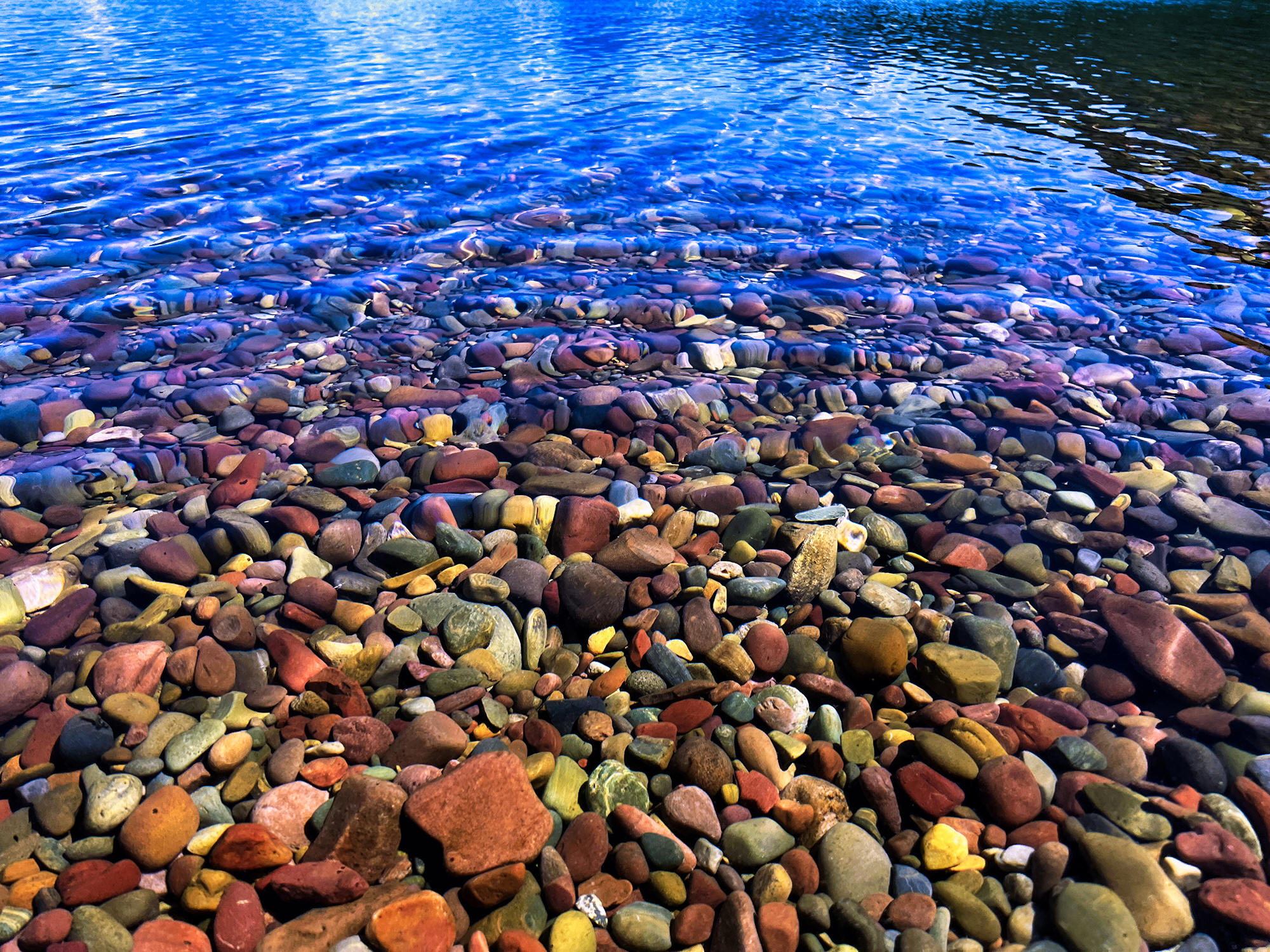 Lake MacDonald Pebbles by Skip Weeks